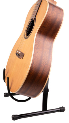 A black guitar stand holding an acoustic guitar on a white background