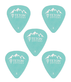 Five teal guitar picks with Teton Guitars branding on a white background